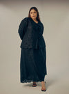 A woman dressed in All Black Tun Habiba Eyelet Set
