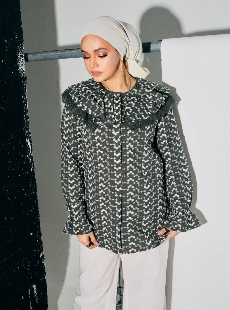 A woman dressed in Army Maisara Eyelet Ruffles Top