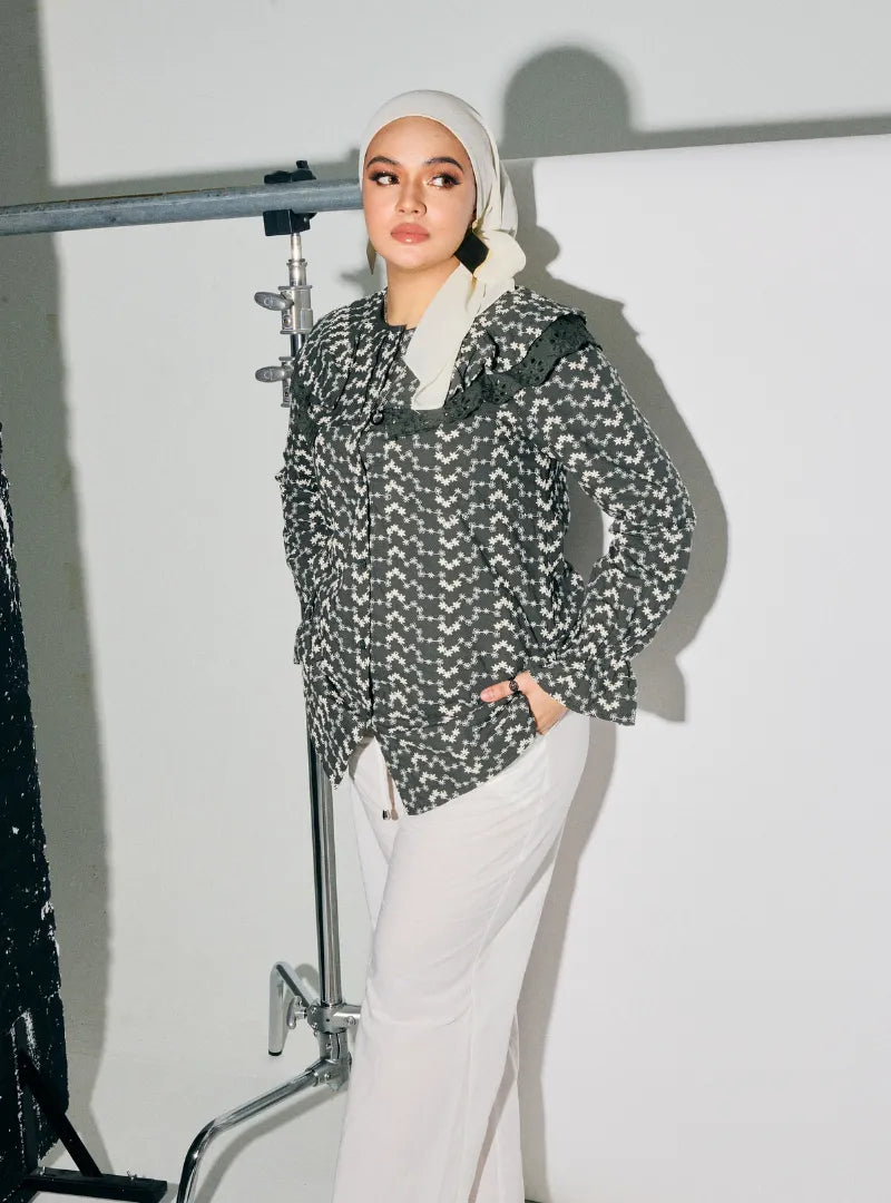 A woman dressed in Army Maisara Eyelet Ruffles Top
