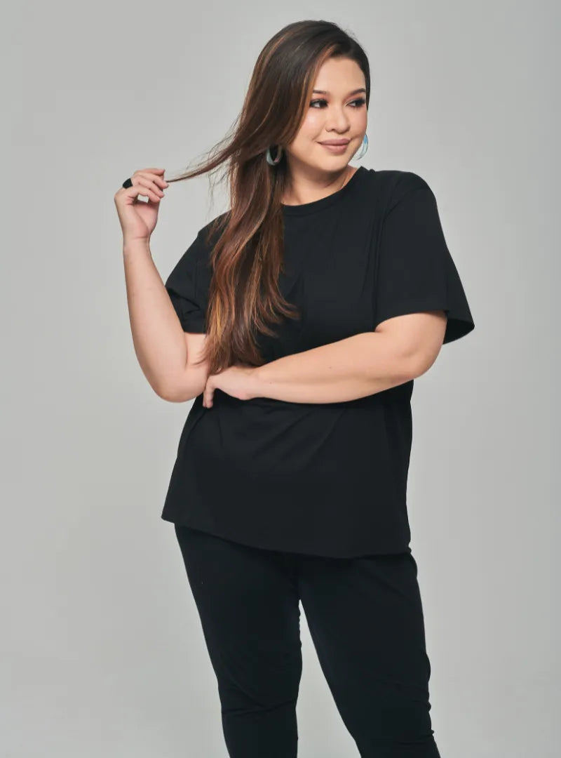 A woman dressed in Black Basic Cotton Tee