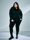 A woman dressed in Black Naddy Mandarin Collar Slim Fit Polo Shirt