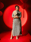 A woman dressed in Black Nyok Jie Cheongsam Checked Midi Dress