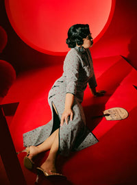 A woman dressed in Black Nyok Jie Cheongsam Checked Midi Dress