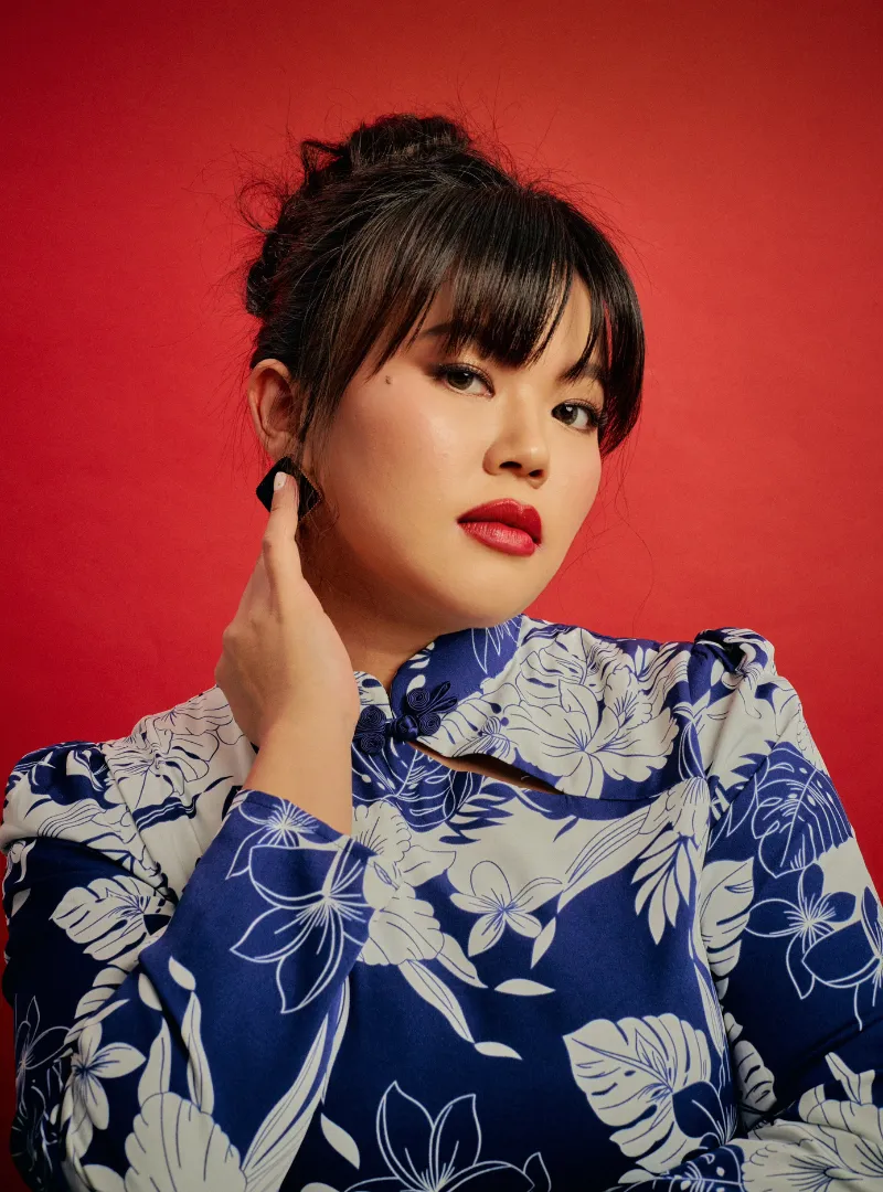 A woman dressed in Blue Ocean Leng Jie Cheongsam Dress