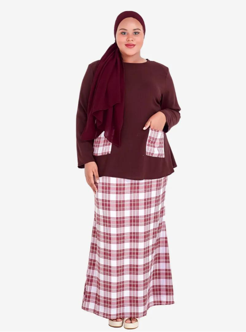 A woman dressed in Burgundy Kurung Kedah Plaid