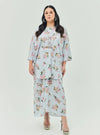 A woman dressed in Baby Blue Lily The Vintage Opah Kurung