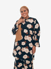 A woman dressed in Black Aminah Kurung Modern