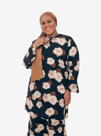A woman dressed in Black Aminah Kurung Modern