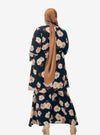A woman dressed in Black Aminah Kurung Modern
