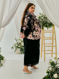 A woman dressed in Black Daisy Tun Jaeda Kebaya Nyonya Kurung