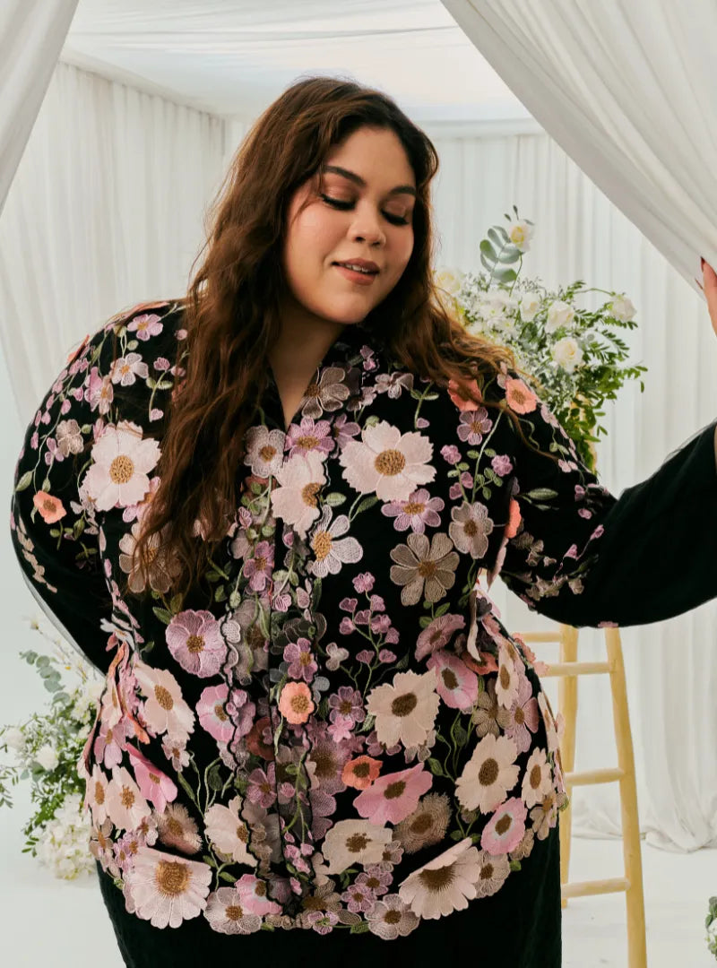 A woman dressed in Black Daisy Tun Jaeda Kebaya Nyonya Kurung