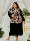 A woman dressed in Black Daisy Tun Jaeda Kebaya Nyonya Kurung