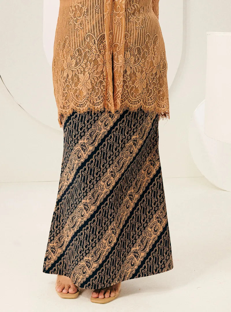 A woman wearing Black Jawa Print Songket Skirt
