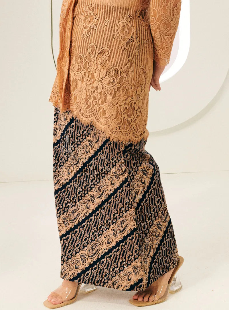 A woman wearing Black Jawa Print Songket Skirt