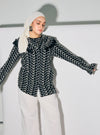 A woman dressed in Black Maisara Eyelet Ruffles Top