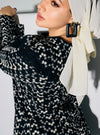 A woman dressed in Black Maisara Eyelet Ruffles Top