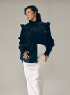A woman dressed in Black Mimi Cotton Broderie Ruffles