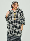 A woman dressed in Black Tanah Tun Azeeza Kaftan Top