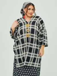 A woman dressed in Black Tanah Tun Azeeza Kaftan Top