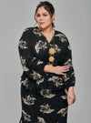 A woman dressed in Black Tun Khadeja Chiffon Wrap Kurung