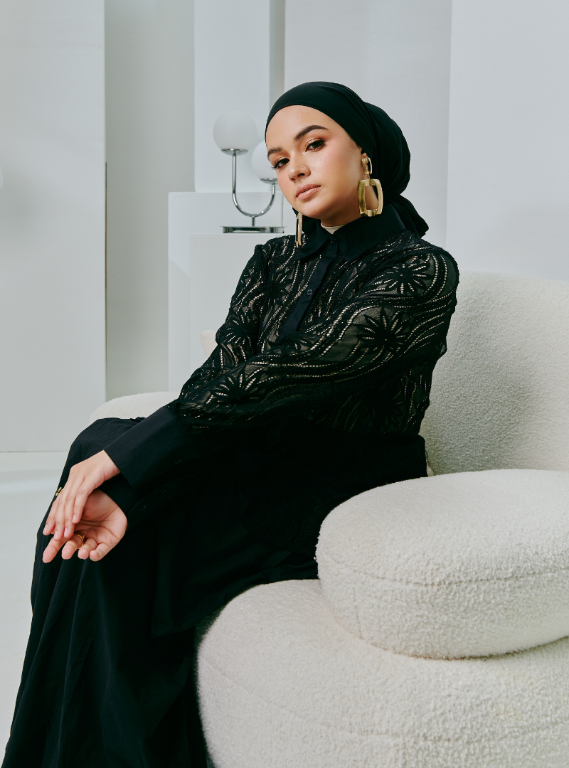 A woman dressed in Black Fiona Regular Lace Shirt