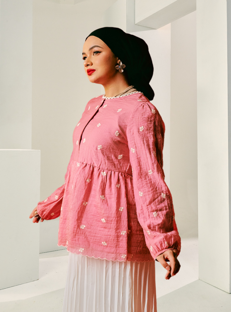 A woman dressed in Bomb Shell Arya Peplum Top