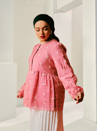 A woman dressed in Bomb Shell Arya Peplum Top