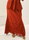 A woman wearing Brick Orange Ezzah Eyelet Doll Skirt