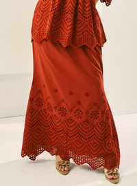 A woman wearing Brick Orange Ezzah Eyelet Doll Skirt