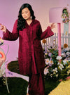 A woman dressed in Burgundy Maroon Tun Sabrina Eyelet Kebarung