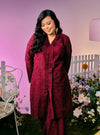 A woman dressed in Burgundy Maroon Tun Sabrina Eyelet Kebarung