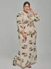 A woman dressed in Champagne Tun Khadeja Chiffon Wrap Kurung