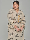 A woman dressed in Champagne Tun Khadeja Chiffon Wrap Kurung