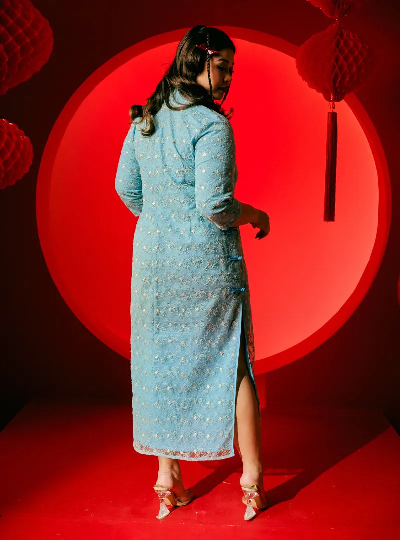 A woman dressed in Columbia Dai Gu Cheongsam Midi Dress