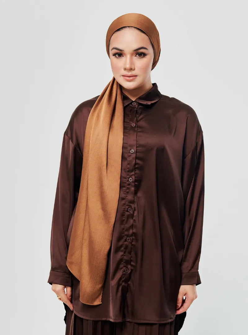 A woman dressed in Dark Chocolate Dropped Shoulder Satin Shirt