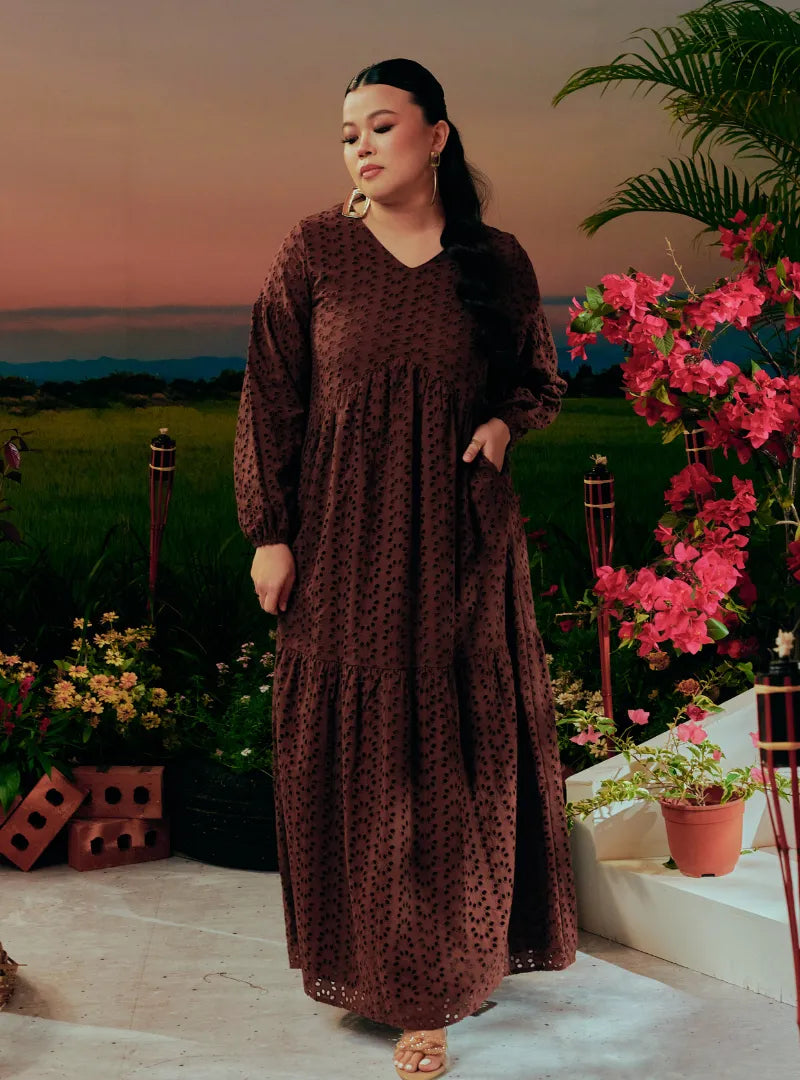A woman dressed in Dark Coco Lola Cotton Eyelet Princess Dress
