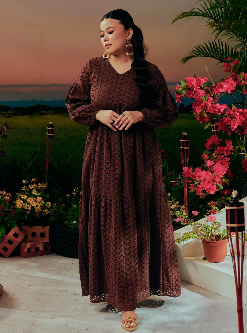 A woman dressed in Dark Coco Lola Cotton Eyelet Princess Dress