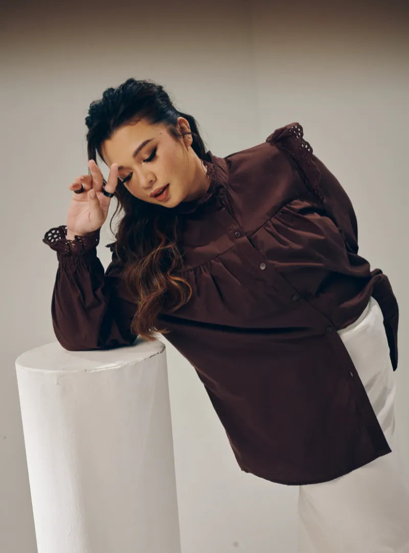 A woman dressed in Dark Coco Mimi Cotton Broderie Ruffles
