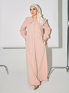A woman dressed in Dusty Pink Marsya Cotton Long Sleeve Dress
