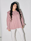 A woman dressed in Dusty Purple Maisara Eyelet Ruffles Top