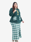 A woman dressed in Emerald Kurung Kedah Plaid