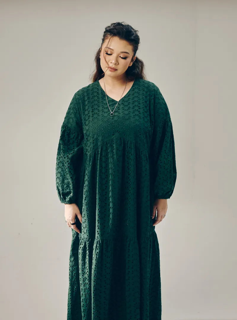 A woman dressed in Emerald Green Lola Cotton Eyelet Princess Dress