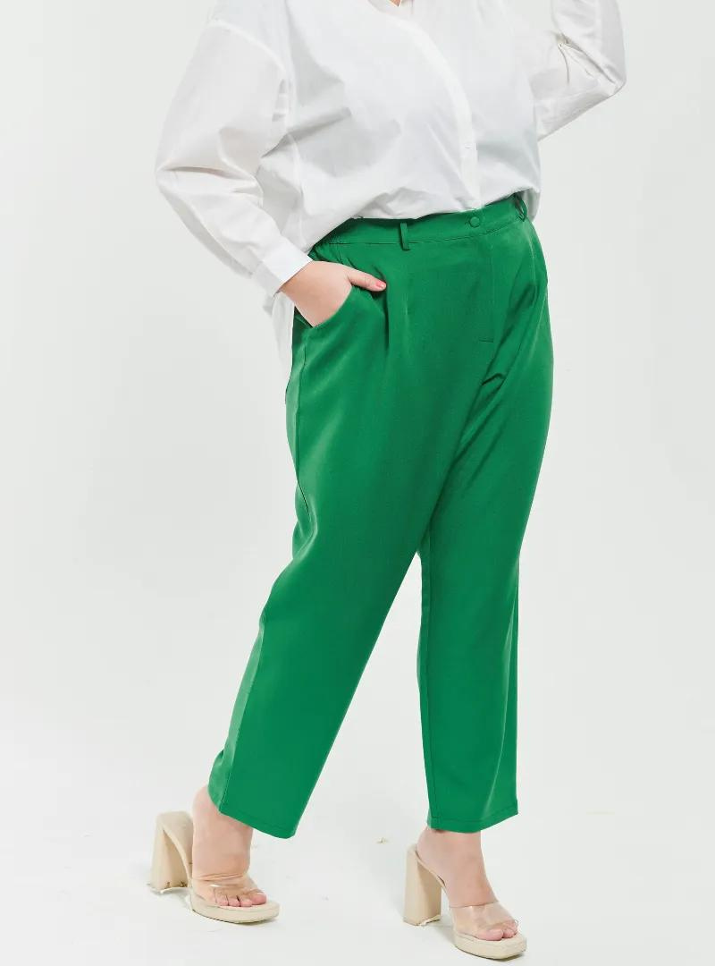 A woman wearing Emerald Green Skinny Tuxedo Trouser