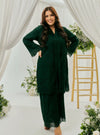 A woman dressed in Emerald Green Tun Sabrina Eyelet Kebarung