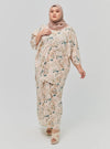A woman dressed in Emerald Ranting The Vintage Opah Kurung