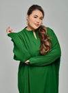A woman dressed in Emerald Tun Aimellia Pleated Maxi Dress