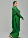 A woman dressed in Emerald Tun Aimellia Pleated Maxi Dress