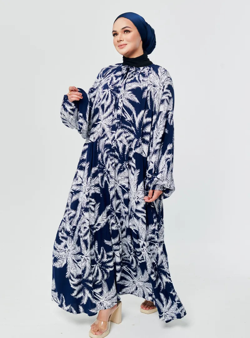 A woman dressed in Coconut Navy The Bloom