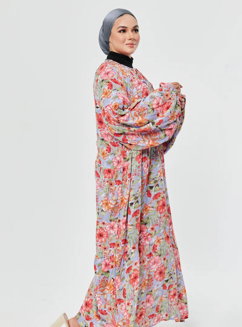 A woman dressed in Fleur Baby Blue The Bloom