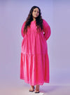 A woman dressed in Hot Pink Lola Cotton Eyelet Princess Dress